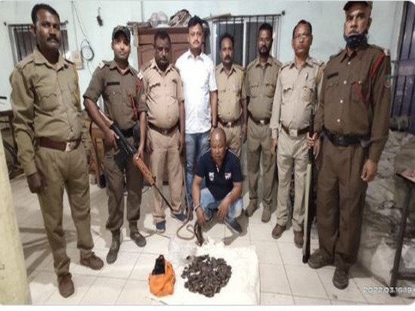 Assam forest officials with arrested pangolin poacher. (ANI/photo)