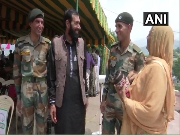 Tariq and Shabbir, brothers of slain rifleman Aurangzeb with their family in Rajouri on Monday. Photo/ANI
