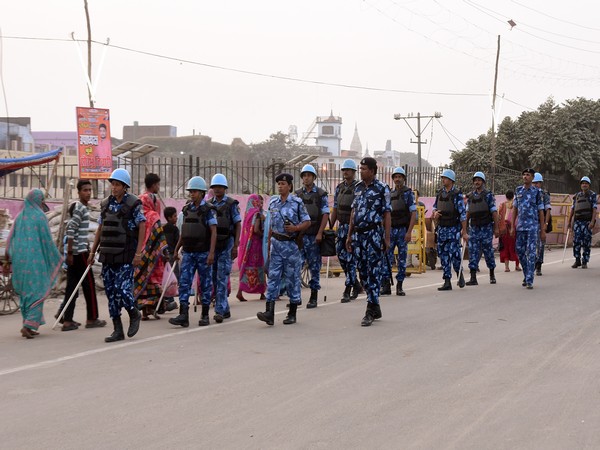 Security personnel march at a road in Ayodhya on Friday. Photo/ANI