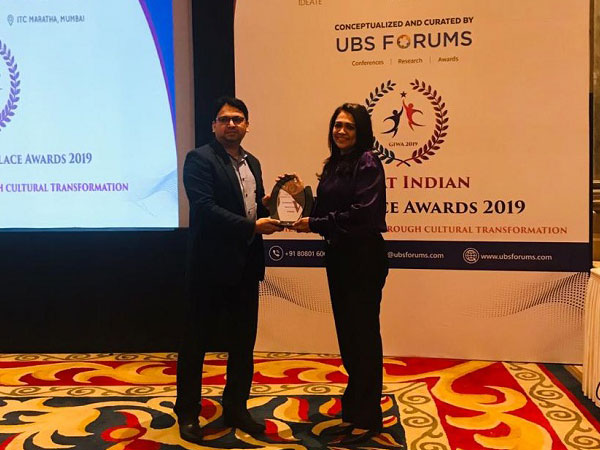 Maria Rajesh receiving the 'Best Workplace of the Year' award at 