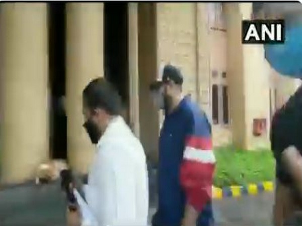 Rapper Badshah (centre) reaches Crime Branch office in Mumbai for questioning on Friday. (Photo/ANI)