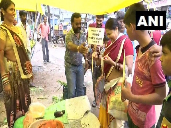 Surendra Bairagi distributing cloth bags in Raipur on Thursday 