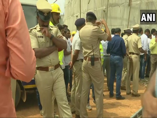 Rescue team outside the collapsed water tank construction site
