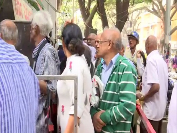Visual outside a branch of Sri Guru Raghavendra Co-operative Bank in Bengaluru. Photo/ANI