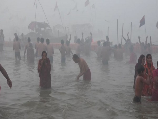Devotees take a holy dip on the occasion of 'Basant Panchami' in Prayagraj on Saturday. 