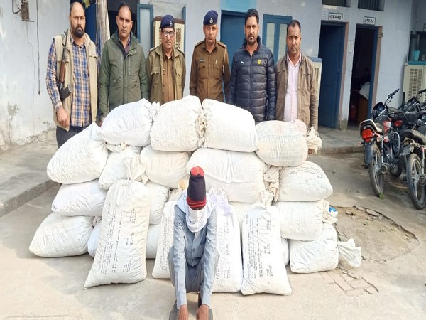 Haryana Police with the arrested individual in Sirsa district on Saturday.