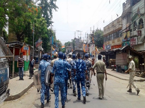 Paramilitary personnel march as a clash broke out between two groups in Bhatpara on June 26. 
