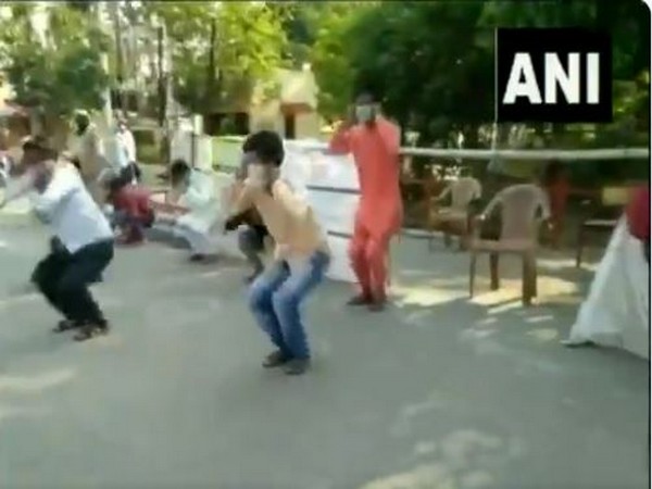 Police and local administration make people do sit-ups for violating norms.