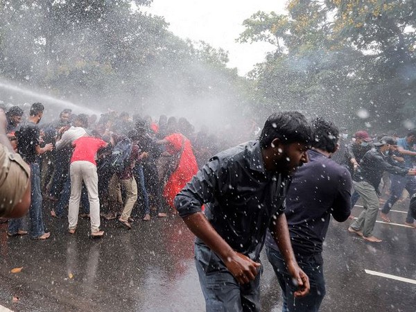 Police use water cannon on demonstrators during a protest near the Sri Lankan Parliament (Photo Credit: Reuters)
