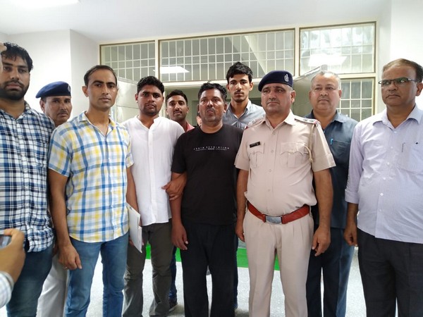 The prime accused in Bhiwani triple murder case arrested with the police team. Photo/ANI