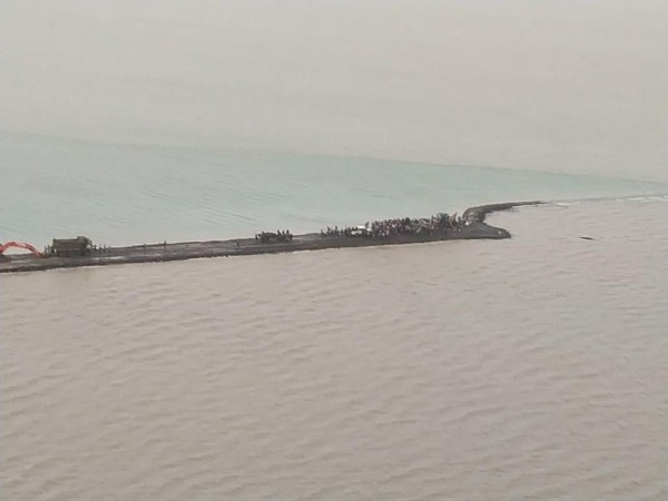 A road washed away from two sides in Hajipur, Gujarat.
