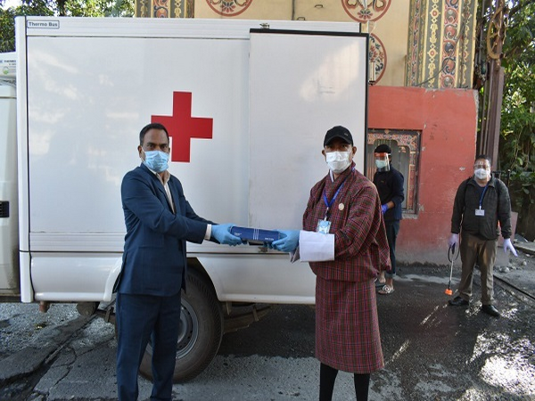 Indian diplomat giving COVID-19 kits to Bhutan, Photo Credit: (Twitter/ India in Bhutan)