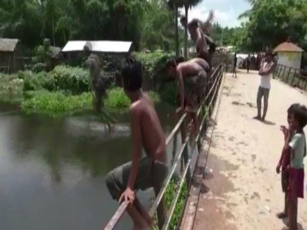 Kids jumping in Mahananda River