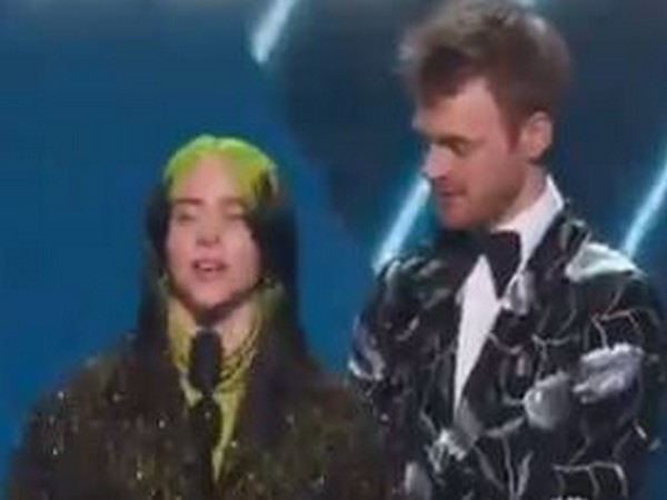 Singer Billie Eilish and brother Finneas accepting Grammy award (Image Source: Grammy Twitter)