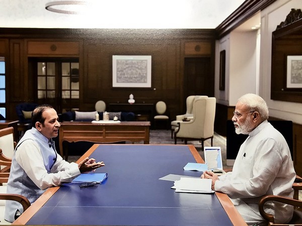 The Indian High Commissioner to Pakistan, Ajay Bisaria (L), with Prime Minister Narendra Modi (R) in New Delhi on Thursday (Photo/Bisaria's Twitter)