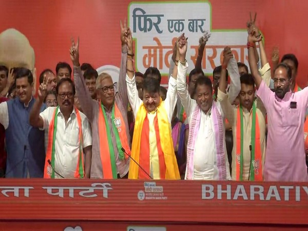 Three MLAs and over 60 municipal councillors were inducted into the BJP here on Tuesday. (Photo/ANI)