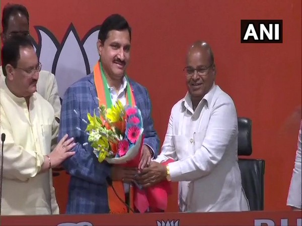 TDP Rajya Sabha MP formally joined BJP here o Thursday along with two others 