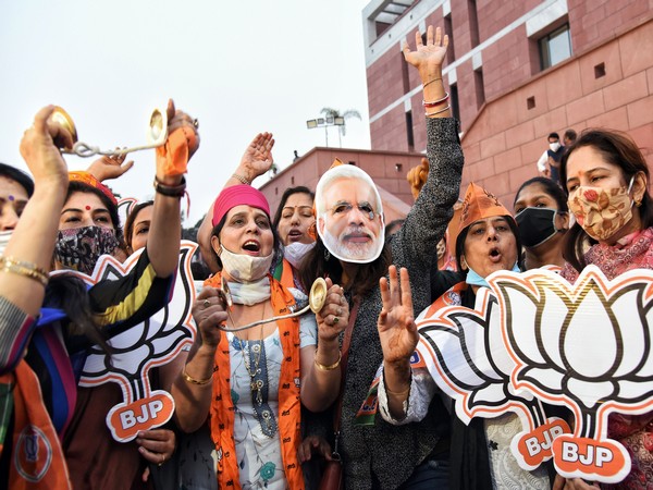 BJP supporters celebrate party's victory at party headquarters in New Delhi . (ANI Photo)