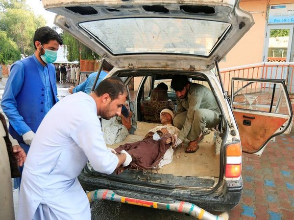 An injured person being taken to a hospital after bomb blasts at a mosque in Afghanistan