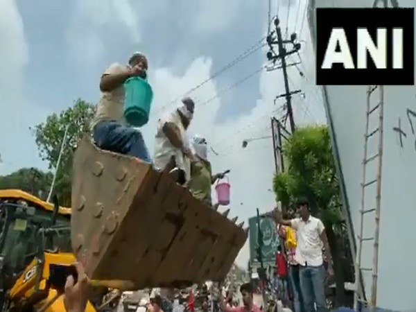 Jan Adhikar party chief Pappu Yadav defacing a Chinese product banner in Patna, Bihar on Thursday.