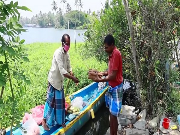 Boatman Sabu purchases commodities from Alappuzha market and delivers them to families on the island. Photo/ANI