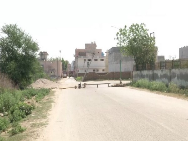 The blocked entrance to Begumpur Khatola village. Photo/ANI