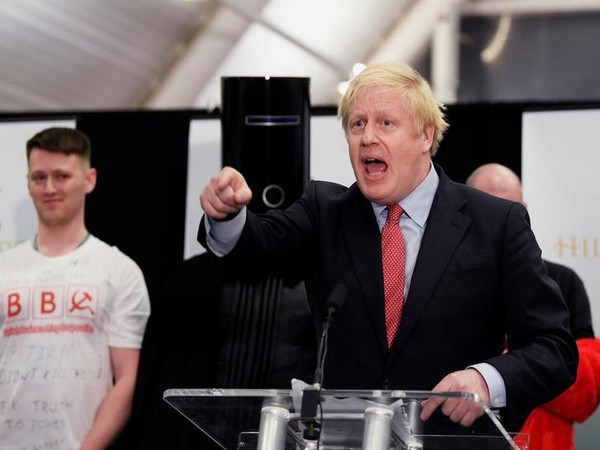 Boris Johnson gestures while speaking after winning his seat in Britain's general election