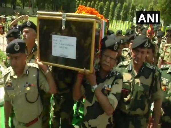 DG RK Mishra and other BSF personnel lending a shoulder to the mortal remains of the soldier on Tuesday. Photo: ANI