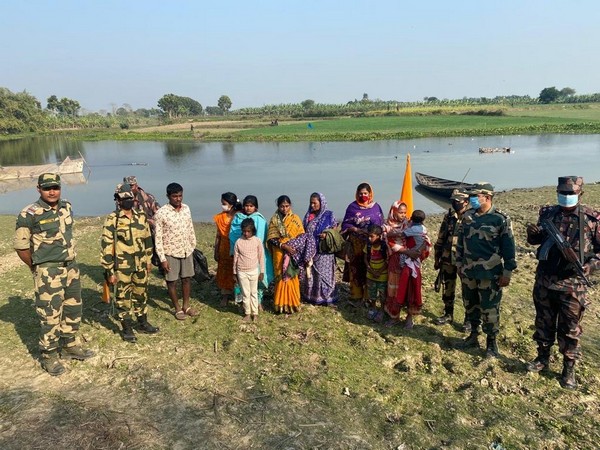 BSF troops handing over 9 Bangladeshi nationals to Bengladesh authorities on Monday. (Photo/ANI)