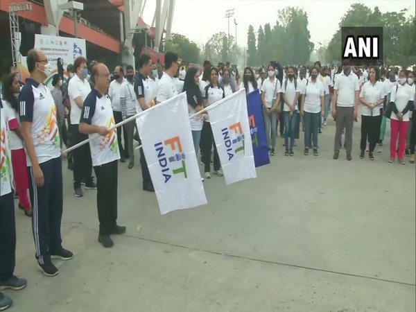 Union Sports Minister Kiren Rijiju flagging off a walkathon on the occasion of International Women's Day at Jawaharlal Nehru Stadium in Delhi