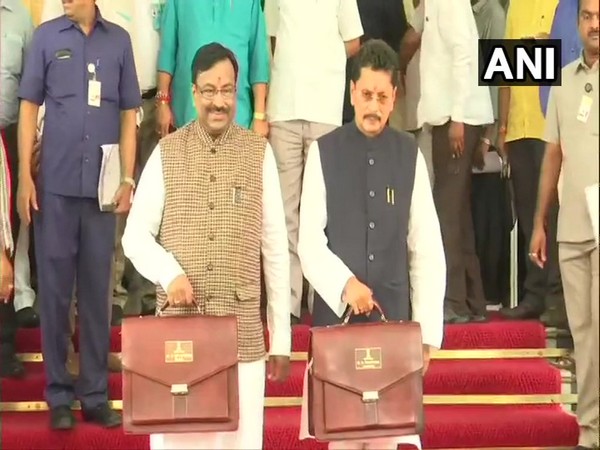 Maharashtra Finance Minister Sudhir Mungantiwar and state minister Deepak Kesarkar with the 'Budget briefcase' at Maharashtra Assembly on Tuesday