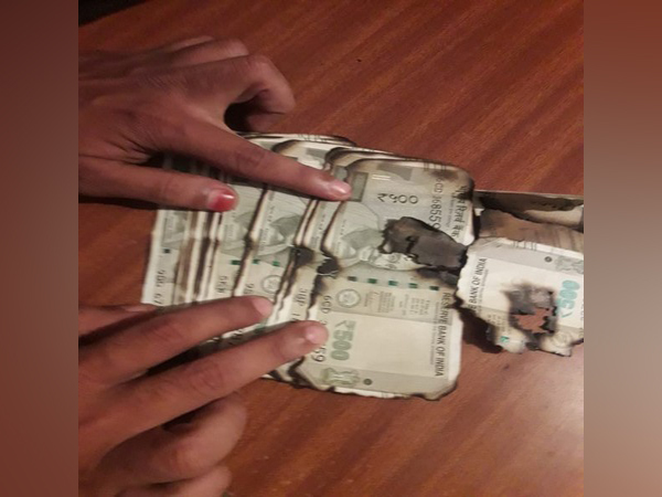 Money used during the trap laid by ACB were burned by forest official wife. (Photo/ANI)