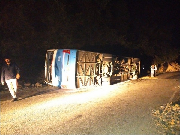 Visuals of the bus overtuned in Solan, Himachal Pradesh on Saturday. Photo/ANI