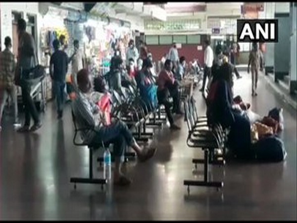 Passengers arrive at KSRTC bus stand in Mangaluru during statewide bandh in Karnataka on Monday. Photo/ANI