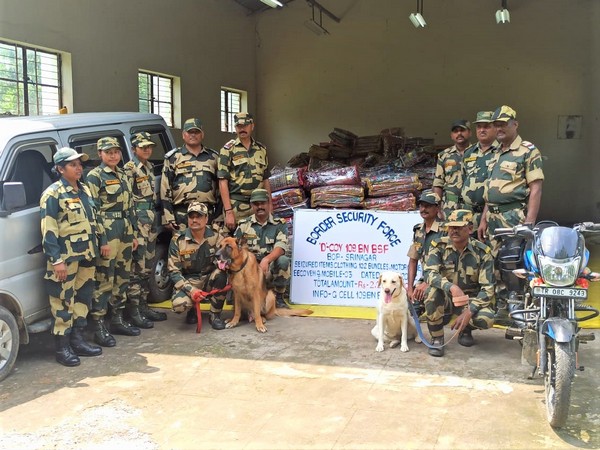BSF troop with seized items in Tripura. (ANI/photo)