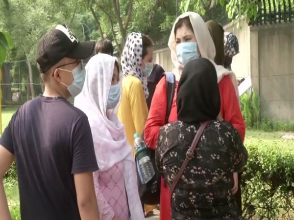 Afghan nationals waiting outside Australian Embassy in Delhi (Photo/ANI)