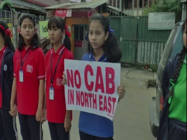 A girl holding placard 