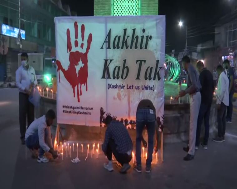 Visuals of candle light protest from J-K's Srinagar (Photo/ANI)