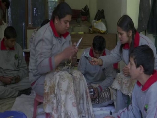 Specially abled children of Udaan Special School of New Shimla making candles for Diwali. Photo/ANI