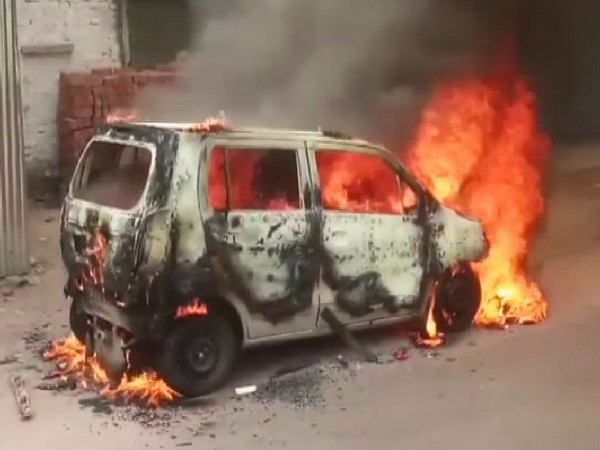 A moving car caught fire in Lucknow on Thursday. Photo/ANI