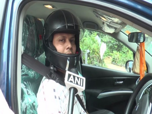 Piyush Varshney, who got an e-challan for not wearing helmet while driving his car, speaking to ANI in Aligarh, Uttar Pradesh on Satuday (Photo/ANI)