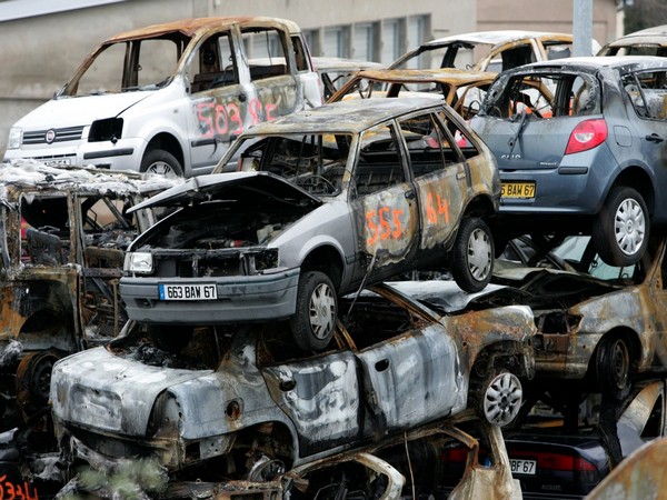 Cars torched on New Year's Eve in France's Strasbourg are piled up at the police pound. (Image credit: Reuters)