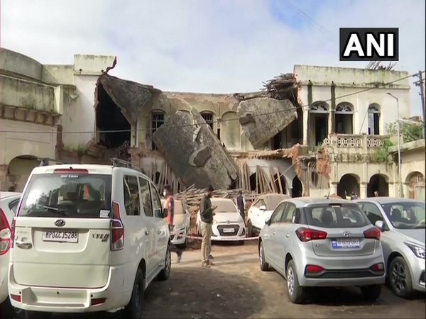 Several vehicles were damaged after parts of an old building collapsed in a parking area in Bhopal. (Photo/ANI)
