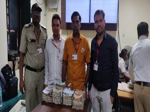 Election Commission officials with seized cash in Mumbai. 