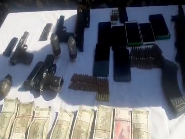 The seized cash, arms and ammunition with the Sopore Police. (Twitter/Sopore Police)