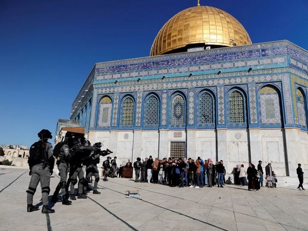 Israeli security forces move in positions during clashes with Palestinian protestors at the compound that houses Al-Aqsa Mosque (Photo Credit: Reuters)