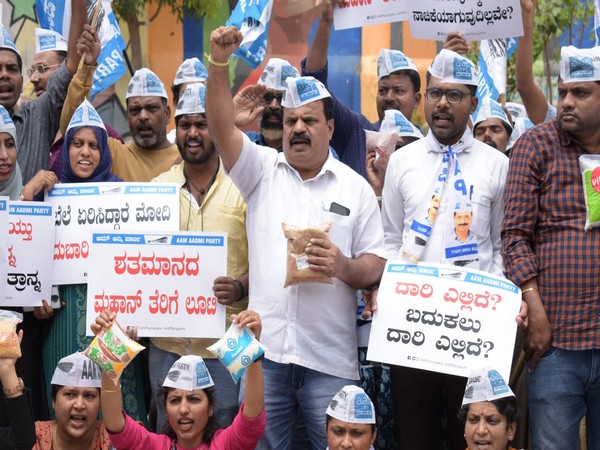 AAP demonstration against rising prices of essential commodities in Bengaluru. (ANI/photo)