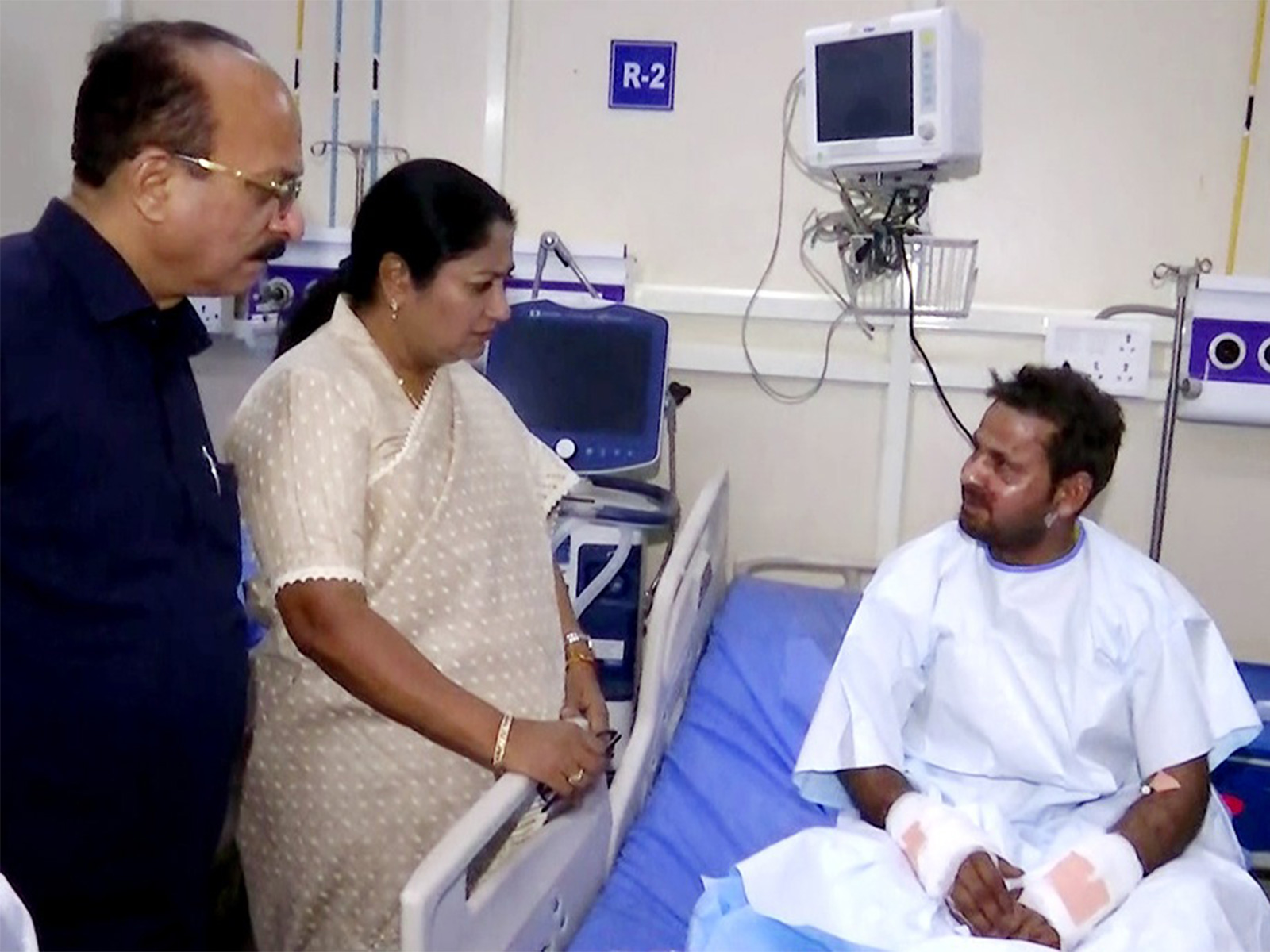 CM Rekha Gupta meeting an injured man at Lok Nayak Hospital (Photo/ANI)