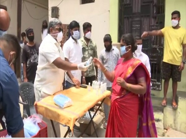 TPCC distributes face masks and sanitizers to poor in Adda Gutta slum of Hyderabad city on Sunday [Photo/ANI]
