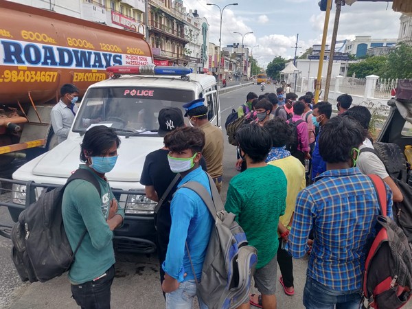 Migrants stopped by police outside Chennai Central Railway Station on Sunday [Photo/ANI]